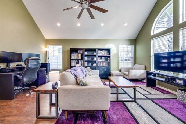 living room featuring ceiling fan, high vaulted ceiling, and hardwood / wood-style flooring