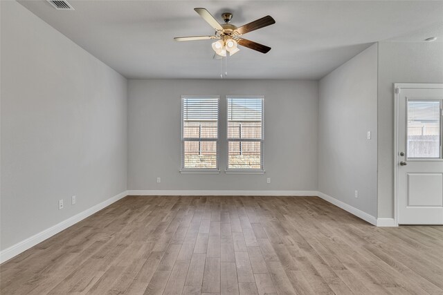 empty room featuring ceiling fan and light wood-type flooring