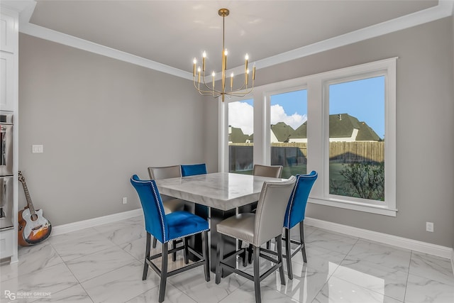 dining area featuring ornamental molding and a chandelier