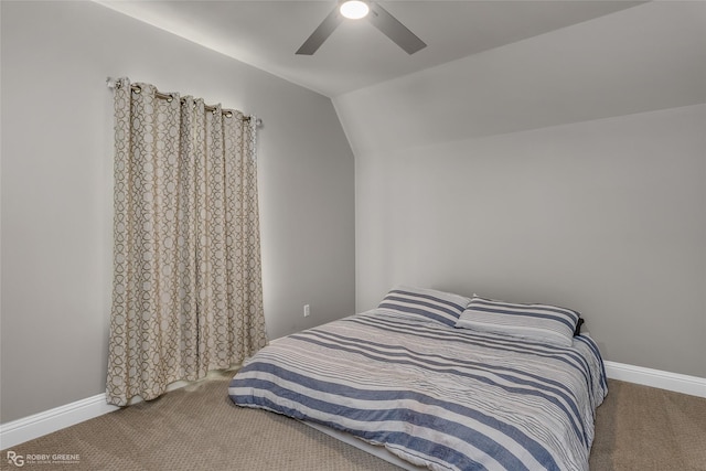 bedroom featuring ceiling fan, lofted ceiling, and carpet