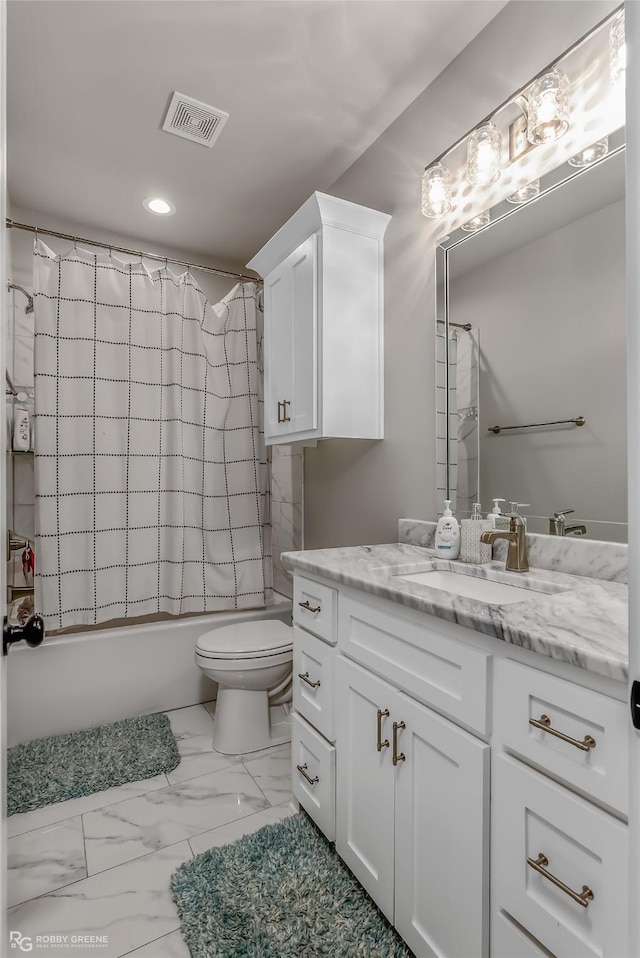 full bathroom with shower / tub combo with curtain, vanity, and toilet