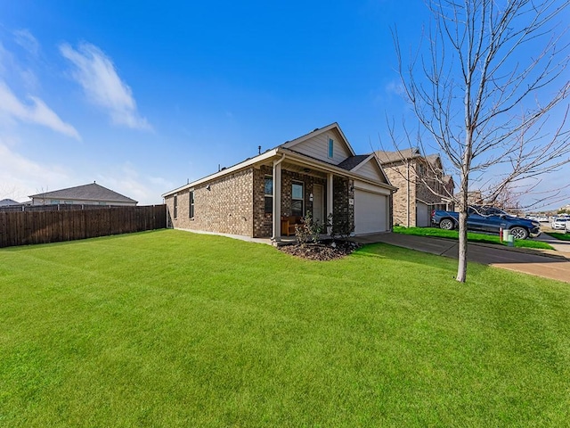 exterior space featuring a garage and a front yard