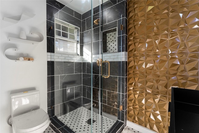 bathroom with tile patterned floors, toilet, and an enclosed shower