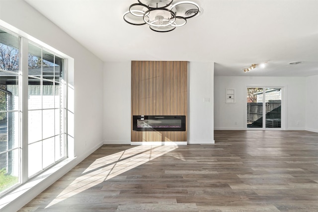 unfurnished living room with dark hardwood / wood-style floors