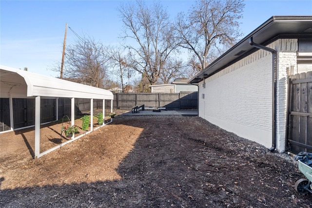 view of yard featuring a carport