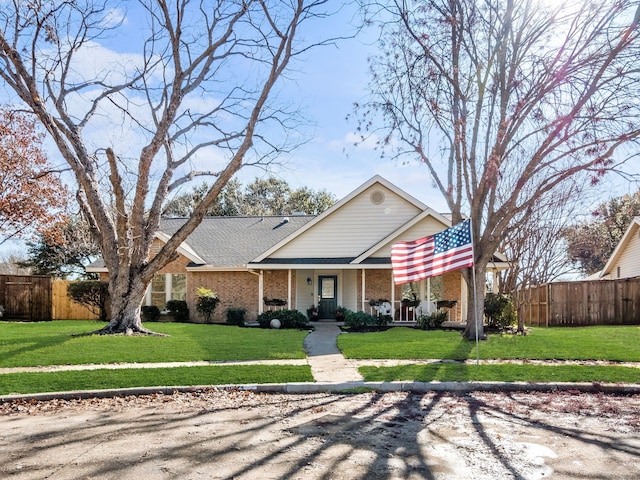 view of front of property with a porch and a front lawn