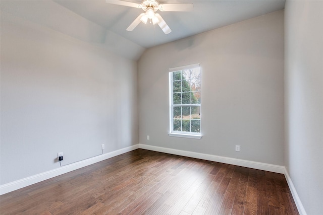 unfurnished room with ceiling fan, lofted ceiling, and dark hardwood / wood-style flooring