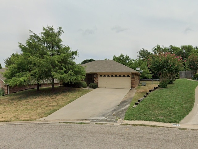 view of front facade with a garage and a front lawn