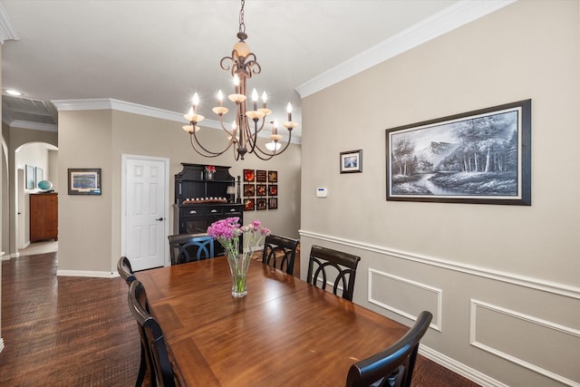 dining space with a notable chandelier, dark hardwood / wood-style flooring, and crown molding