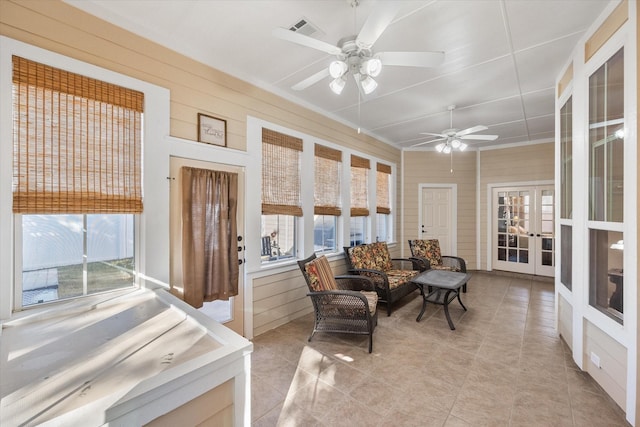 sunroom / solarium with french doors and ceiling fan