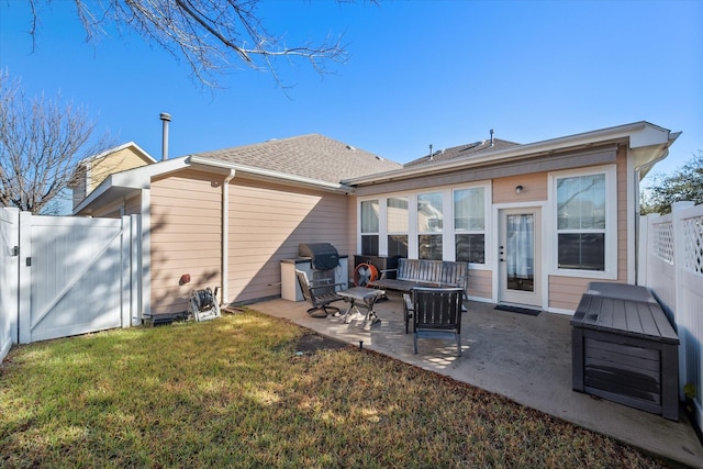 rear view of house with an outdoor living space, a yard, and a patio