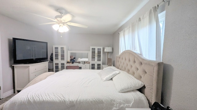 bedroom with french doors and ceiling fan