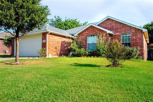 ranch-style home featuring a garage and a front yard