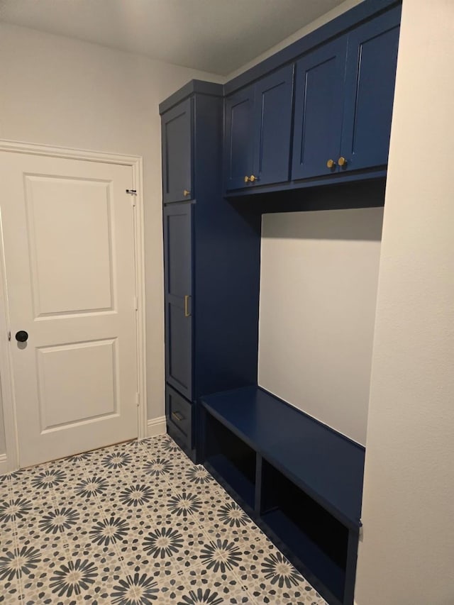 mudroom with light tile patterned floors