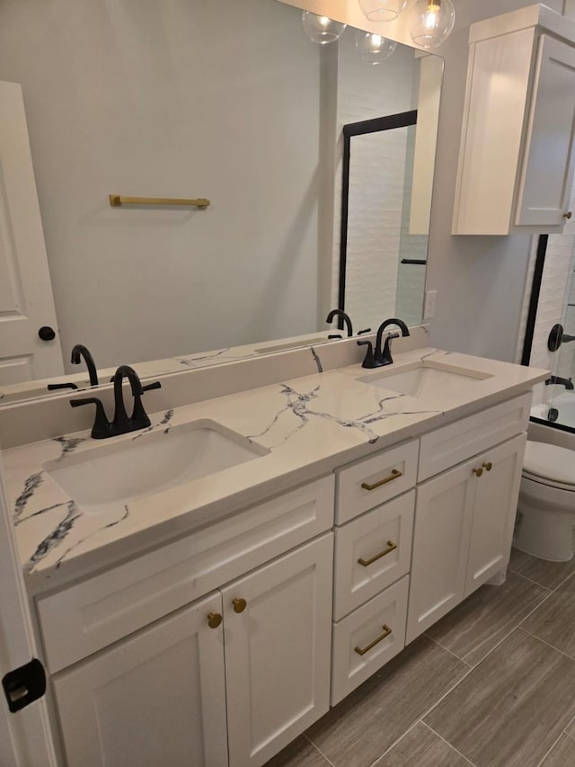 full bathroom with washtub / shower combination, vanity, and toilet