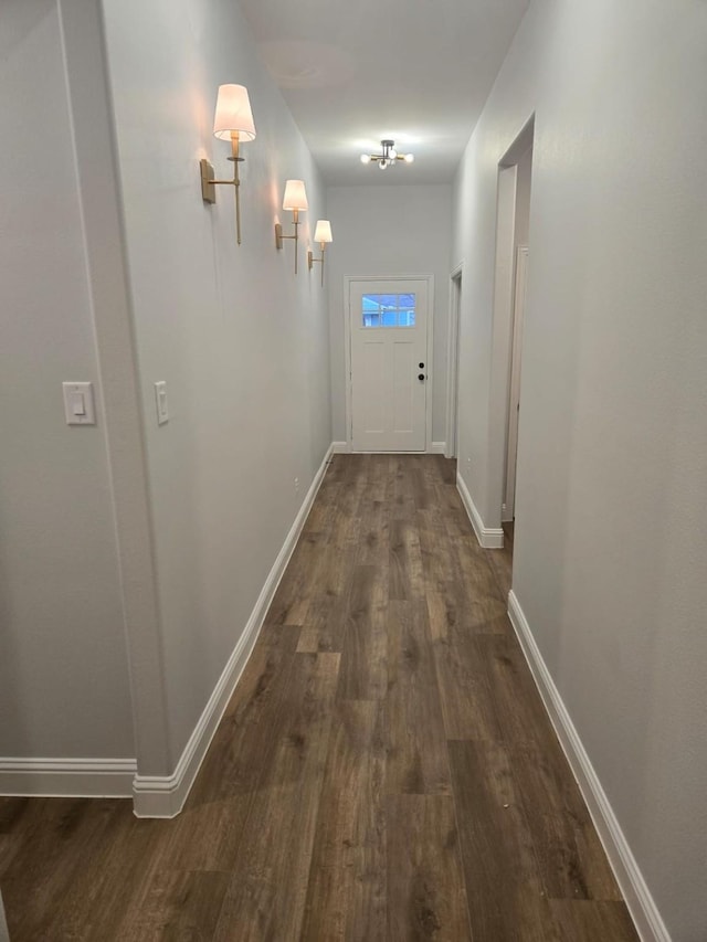 hall with dark hardwood / wood-style floors