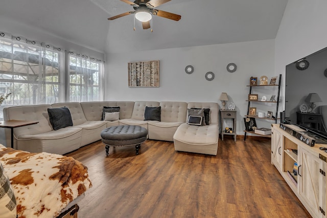 living area featuring vaulted ceiling, ceiling fan, and dark wood finished floors