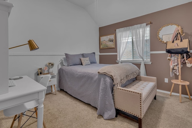 bedroom featuring light carpet, baseboards, and vaulted ceiling