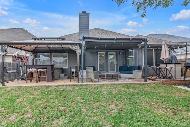 back of house featuring a yard, a patio, a gazebo, and an outdoor hangout area