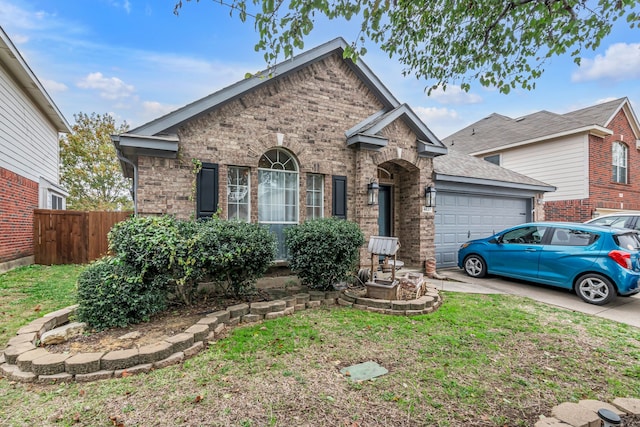 view of front of home featuring a garage and a front yard