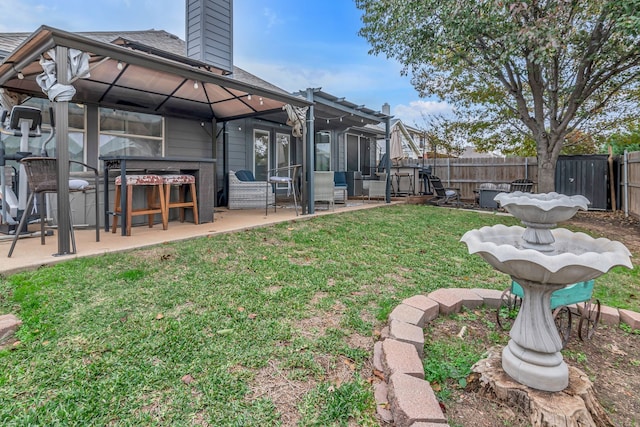 view of yard with a patio and fence