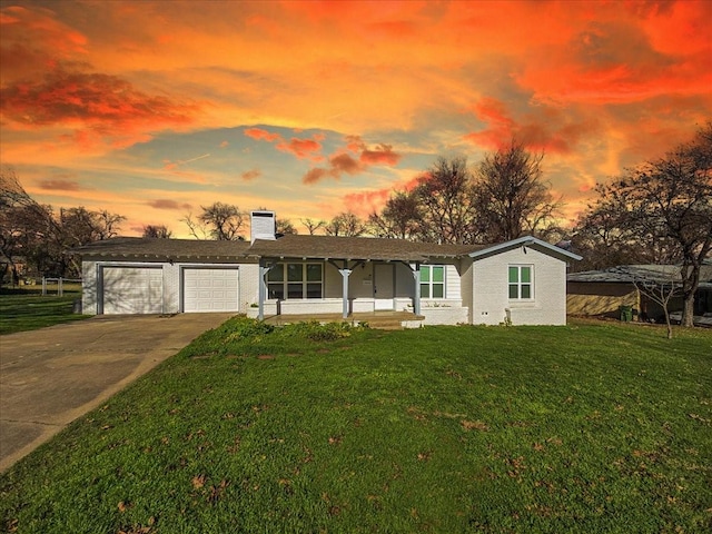 ranch-style house with a lawn and a garage