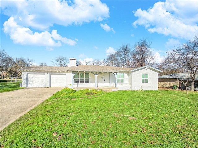 ranch-style home featuring a garage and a front lawn