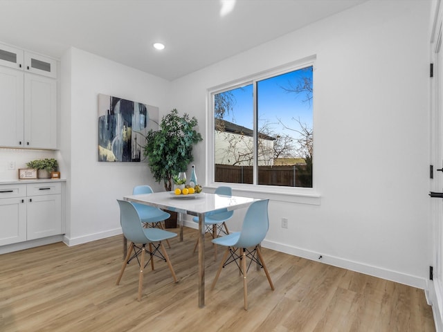 dining space with light wood-type flooring