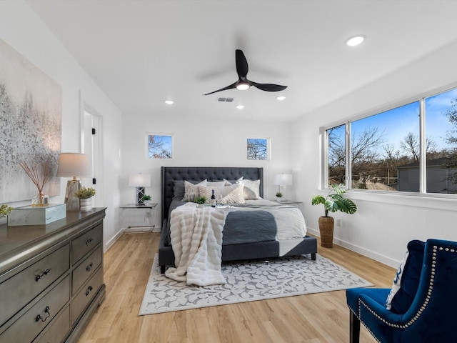 bedroom featuring ceiling fan and light hardwood / wood-style flooring