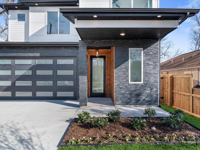 view of exterior entry featuring a garage