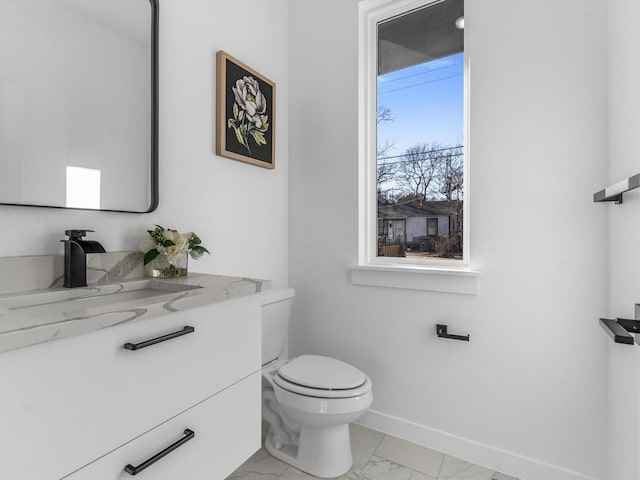 bathroom with toilet and vanity