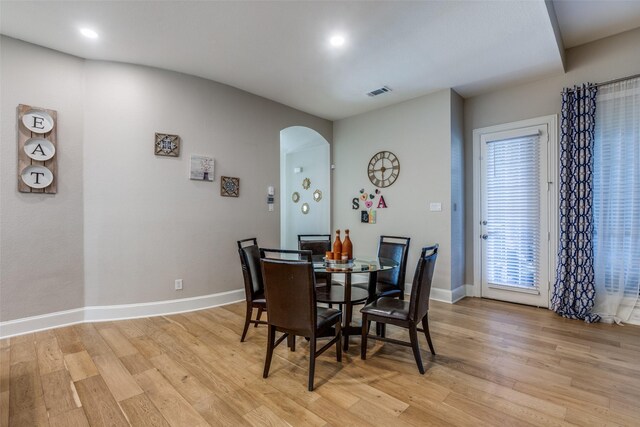 dining room featuring light hardwood / wood-style floors and a wealth of natural light