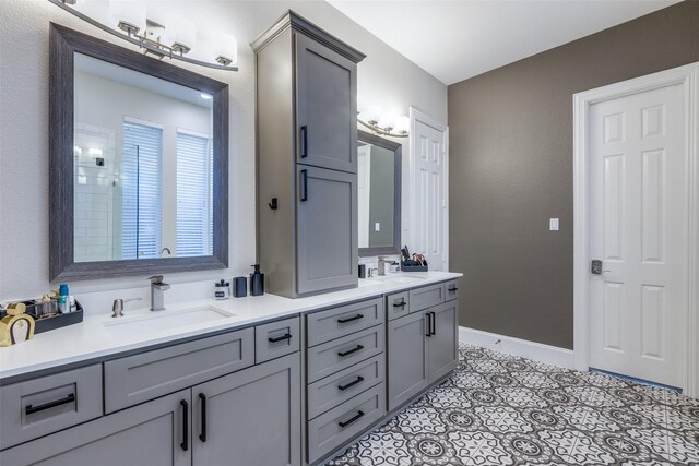 bathroom with tile patterned flooring and vanity