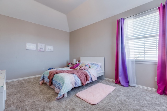 bedroom with light carpet and vaulted ceiling