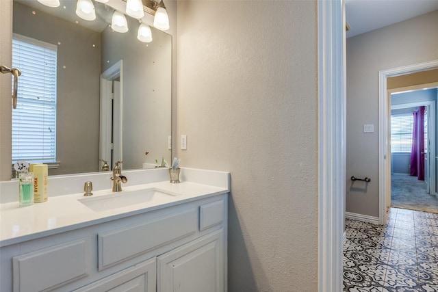 bathroom with vanity and tile patterned floors