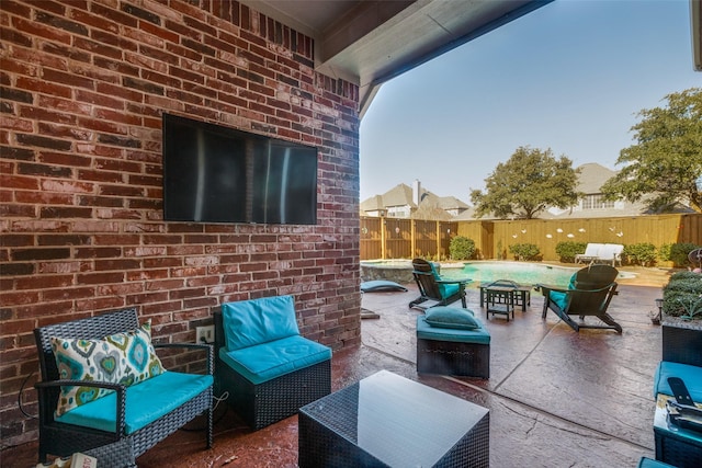 view of patio / terrace with a fenced in pool