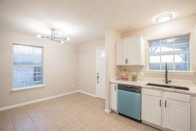 kitchen with white cabinetry, sink, stainless steel dishwasher, a chandelier, and light tile patterned flooring