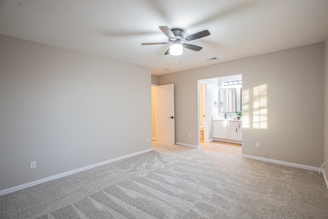 carpeted empty room with ceiling fan