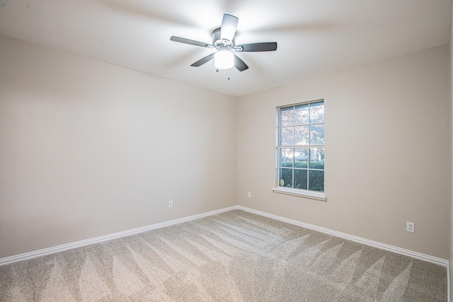 spare room with ceiling fan and carpet floors