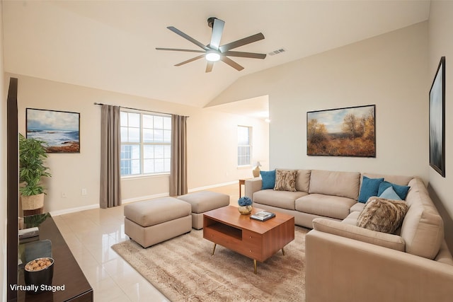 living room featuring ceiling fan, light tile patterned flooring, and vaulted ceiling