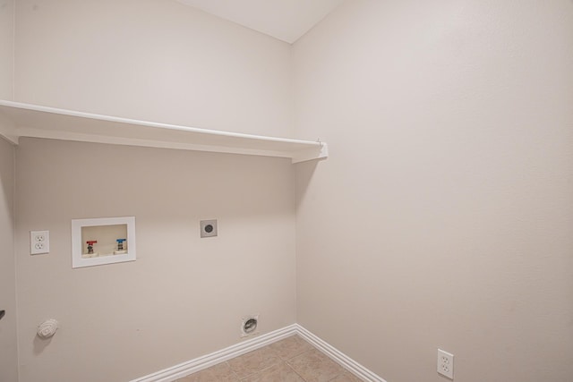 washroom featuring electric dryer hookup, light tile patterned flooring, and washer hookup