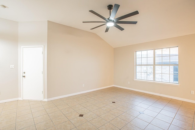 spare room featuring light tile patterned floors, ceiling fan, and lofted ceiling