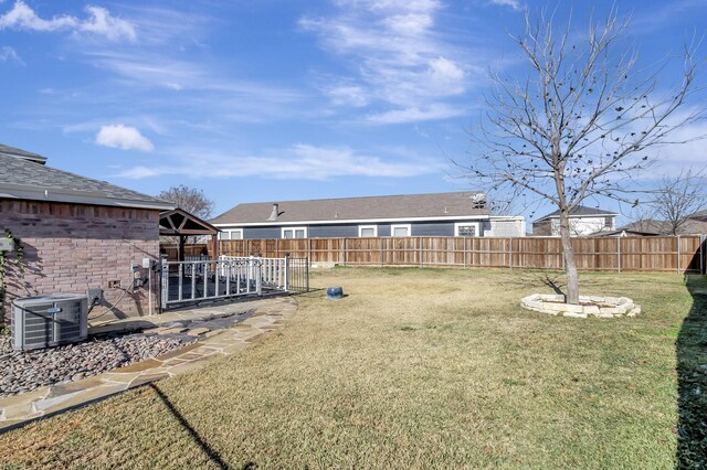 view of yard with central AC unit