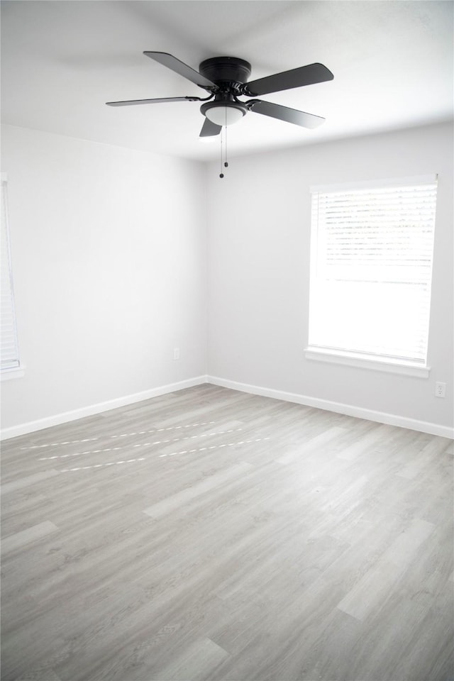 unfurnished room featuring ceiling fan and light hardwood / wood-style floors