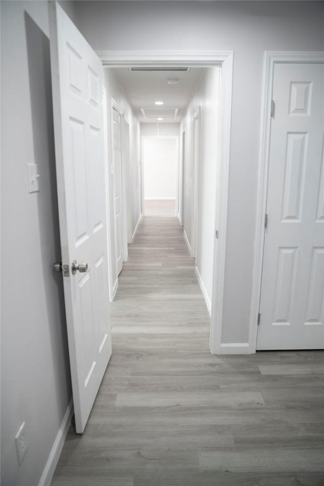 hall with light wood-type flooring