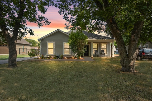 ranch-style house with a lawn