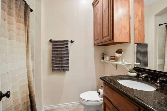 bathroom with vanity, toilet, and ornamental molding