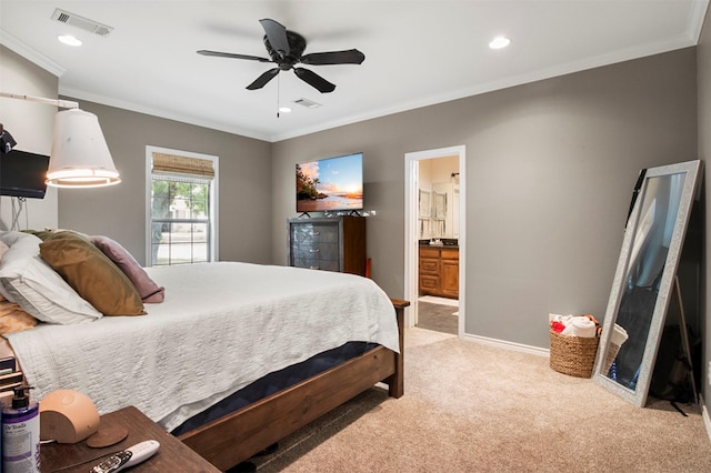 carpeted bedroom featuring connected bathroom, ceiling fan, and ornamental molding