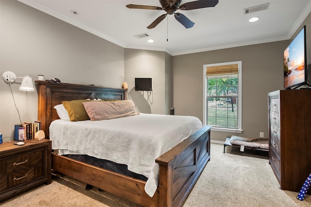 bedroom with ceiling fan, light colored carpet, and ornamental molding