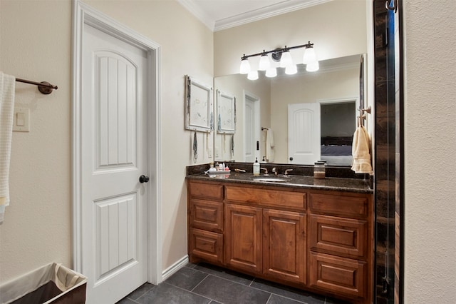 bathroom featuring crown molding, tile patterned flooring, and vanity